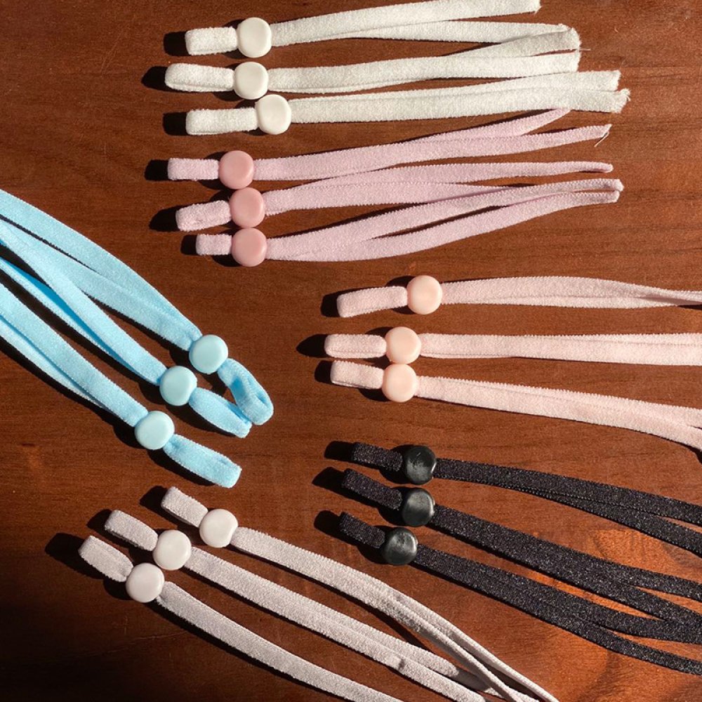 20 vita elastiska band med justerbart spänne för masker.