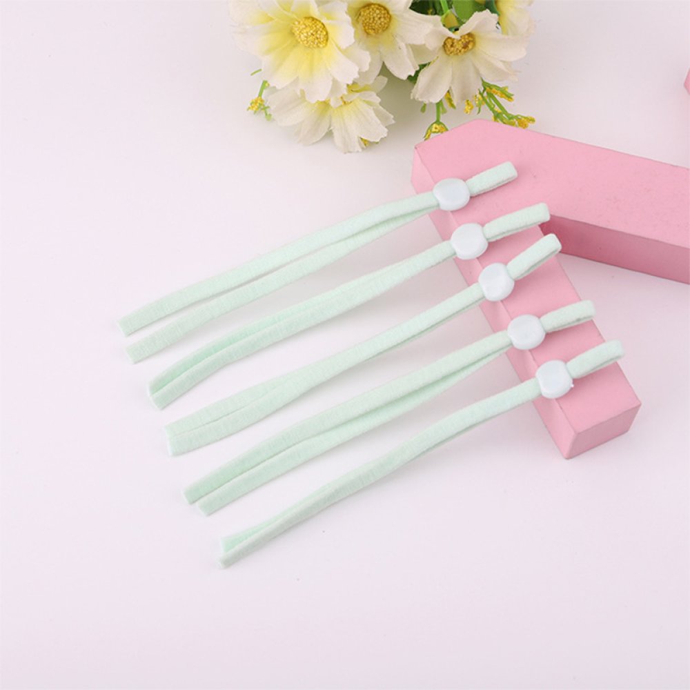 2 Mintgröna elastiska band med justerbar maskinfästningsögla.