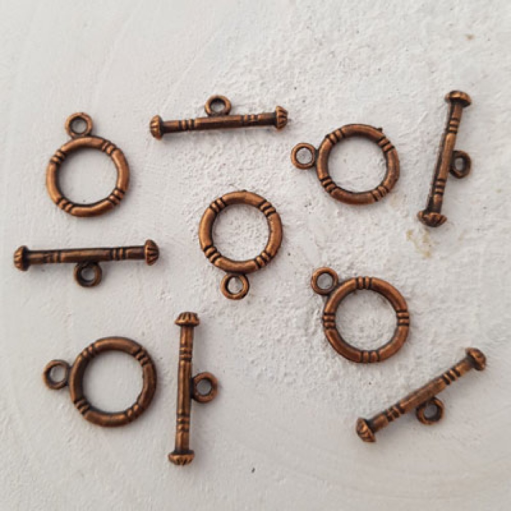 5 vridspännen med runt mönster i brons N°02