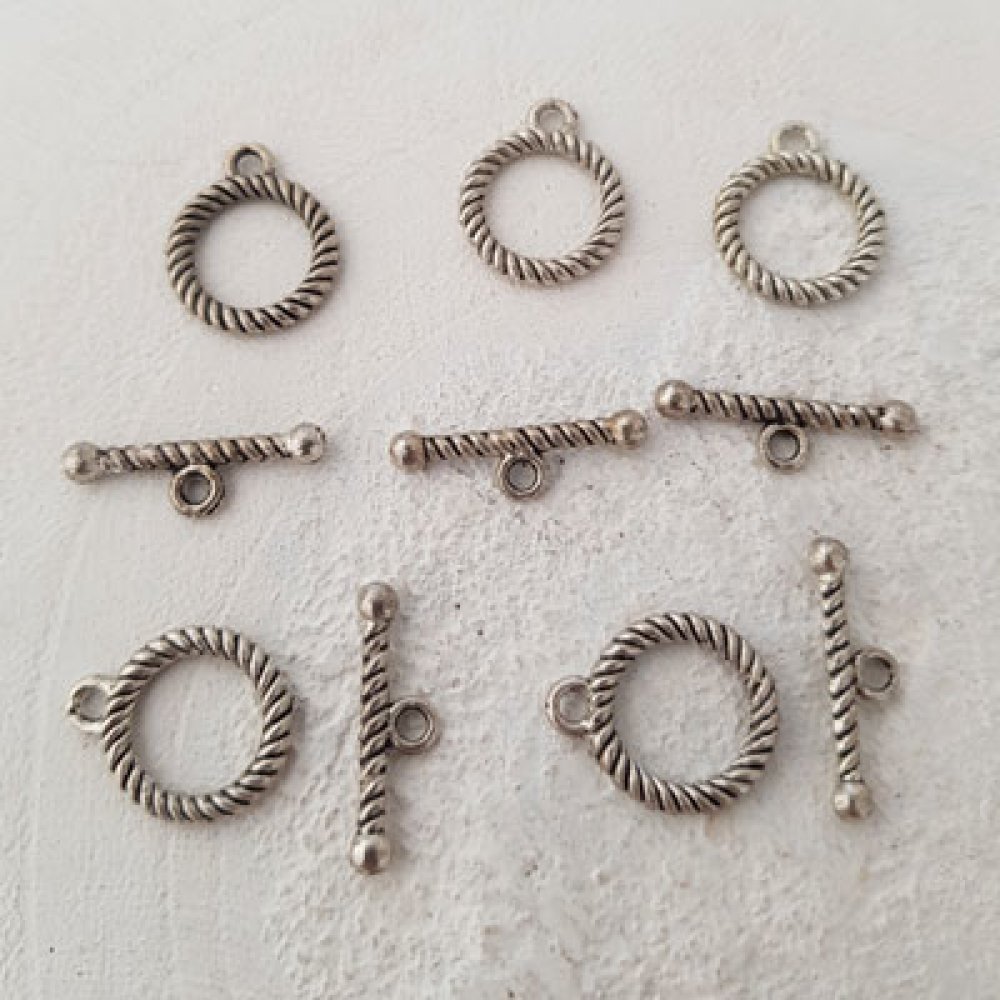 5 vridspännen med runt mönster i silver N°04