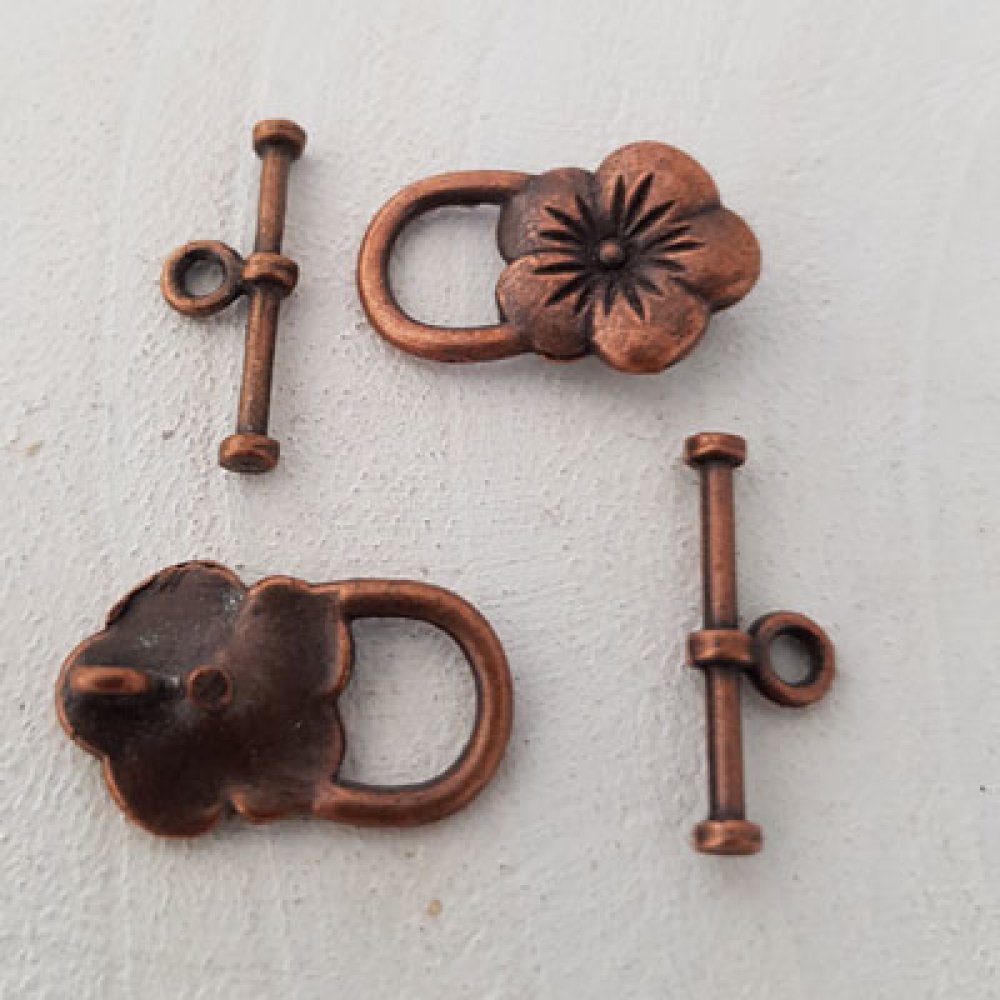5 bygelspännen Blommotiv Brons N°17