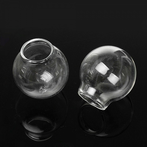 Deux boules en verre transparent de 35 mm à remplir.