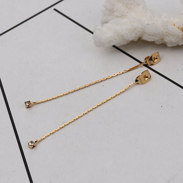 &Auml;kta guldpl&auml;terad koppar &ouml;rh&auml;ngena slutstycke N&deg;01 med genomskinlig strass