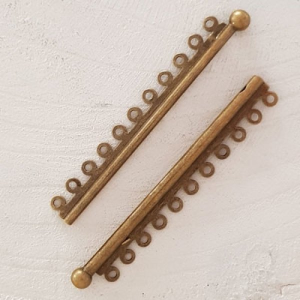 Brons Multi-Rank Clasp.