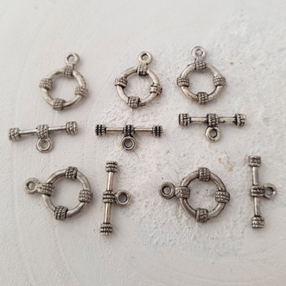 Fästlås med runt mönster i silver N°03
