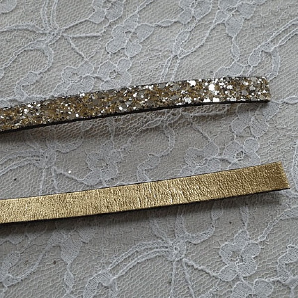 06 mm guldglitterband med l&auml;derfoder per 20 cm