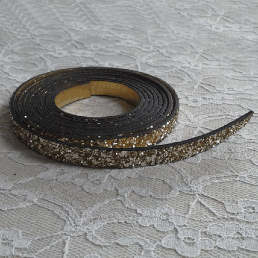 06 mm guldglitterband med läderfoder per 20 cm