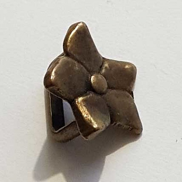 Perle passant fleur bronze pour cuir régaliz 10 mm.