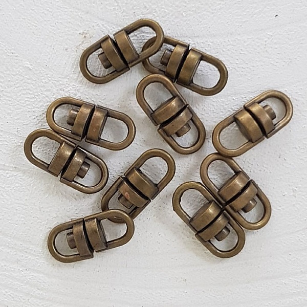 Roterande nyckelringar Brons