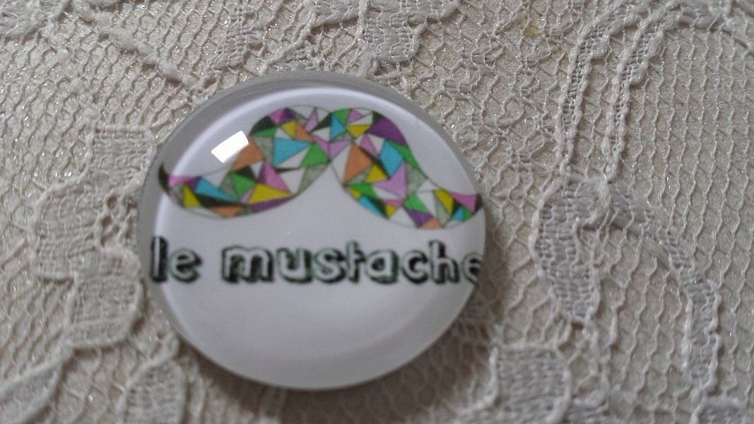 glas cabochon rund 25mm mustasch 010 