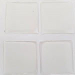 4 självhäftande cabochons av harts 20 x 20 mm Transparent