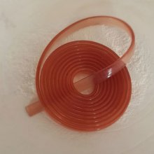 1 meter platt PVC-snöre 5,8 x 1,9 mm gammal rosa genomskinlig