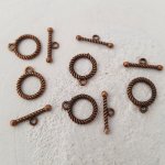 5 vridspännen med runt mönster i brons N°04
