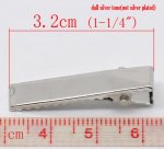 Set med 20 krokodilklämmor - Silverfärg 32 mm x 7 mm.