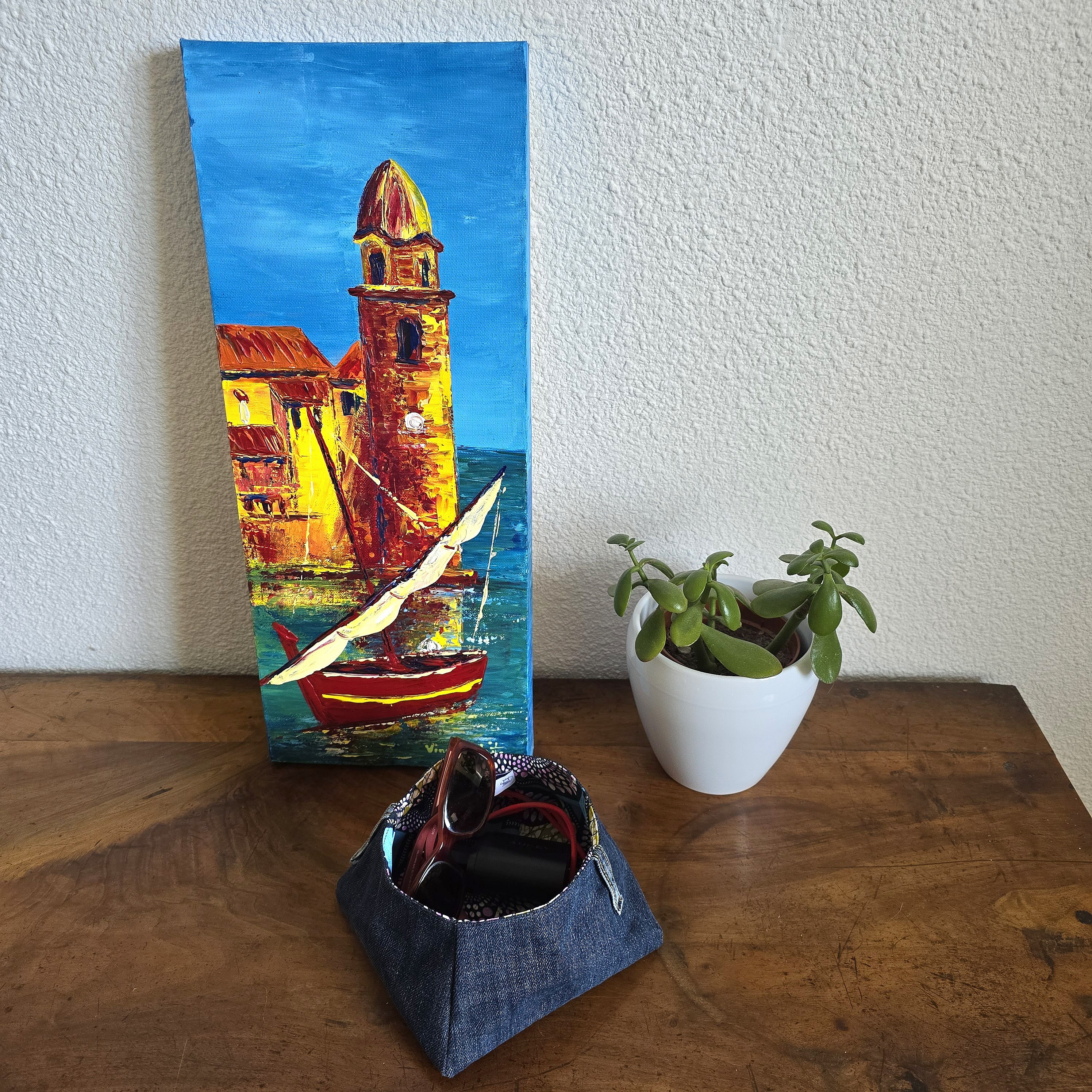 Vide poches en jean , doubl&eacute; de tissu coton imprim&eacute; wax.