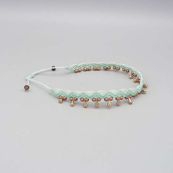 Fotledsring i micro-macram&eacute; "water mint green".