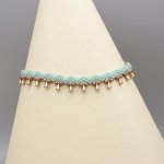 Fotledsring i micro-macramé 'water mint green'.