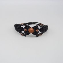 Svart mikro-macramé armband med en central "solsten" pärla