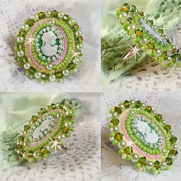 Anisse ring broderad med ett portr&auml;tt av en kvinna med rosor och Swarovskikristaller i cabochon av harts.