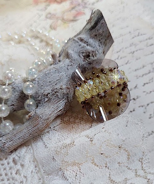 Auroraring med facetter och snurrande toppar i Swarovski-kristall