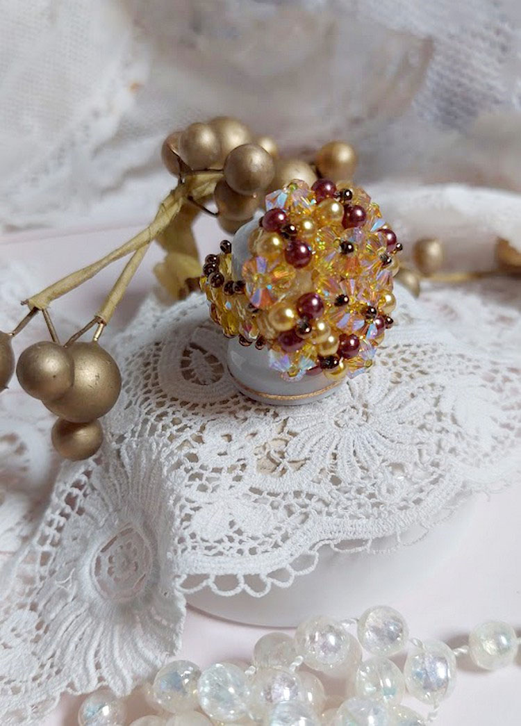 Solskensring med facetter, pärlpärlor och Swarovskikristallspinnare