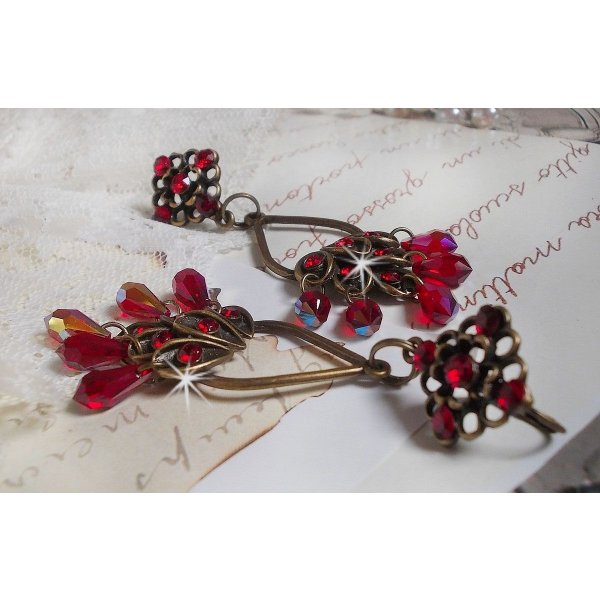 BO Irresistible Ruby Collection monterad på ljusstakar med Swarovski-kristaller.