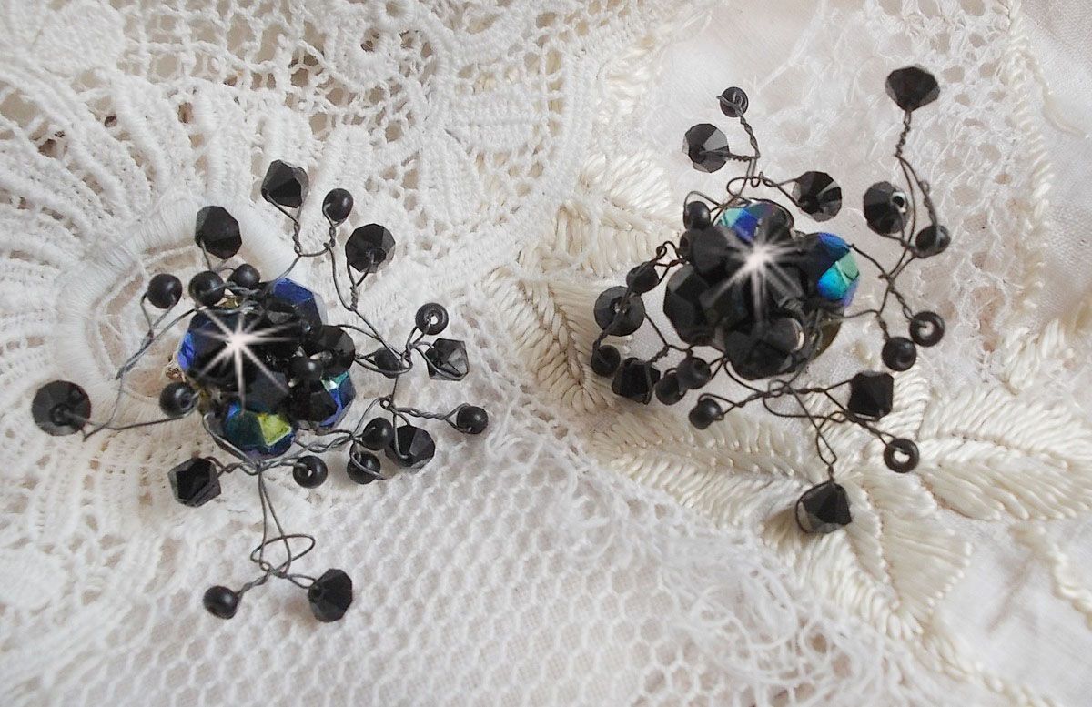 BO Douce Nuit med snurrande toppar av Swarovski-kristall och glasfacetter.