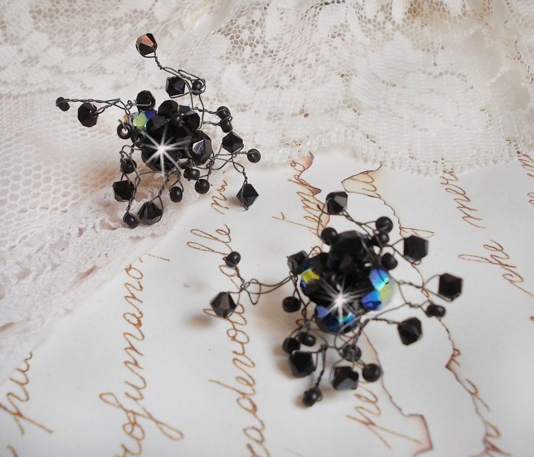 BO Douce Nuit med snurrande toppar av Swarovski-kristall och glasfacetter.
