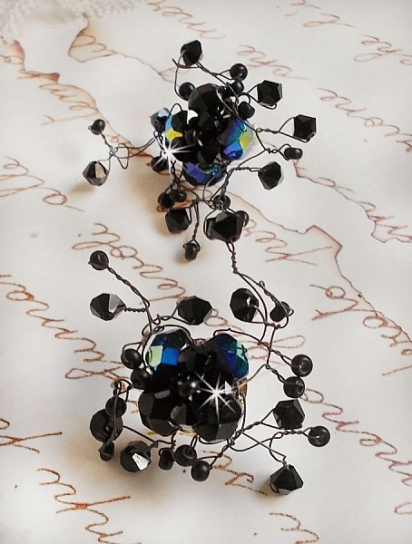 BO Douce Nuit med snurrande toppar av Swarovski-kristall och glasfacetter.