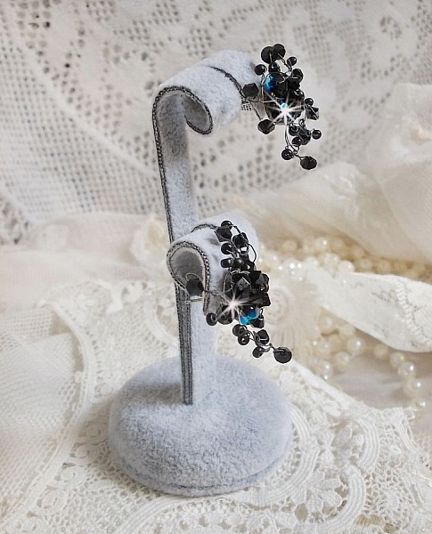 BO Douce Nuit med snurrande toppar av Swarovski-kristall och glasfacetter.