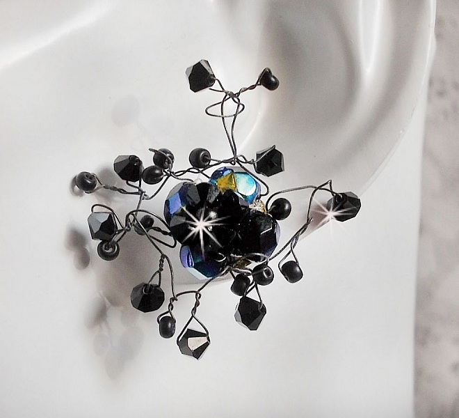 BO Douce Nuit med snurrande toppar av Swarovski-kristall och glasfacetter.