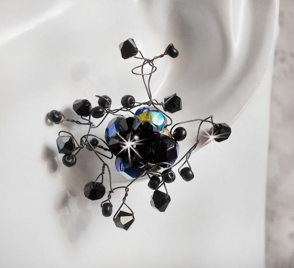 BO Douce Nuit med snurrande toppar av Swarovski-kristall och glasfacetter.