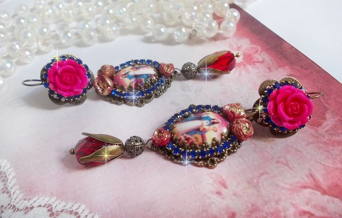 BO Maria och Jesus skapade med harts cabochons, röda facetterade päron och olika tillbehör.