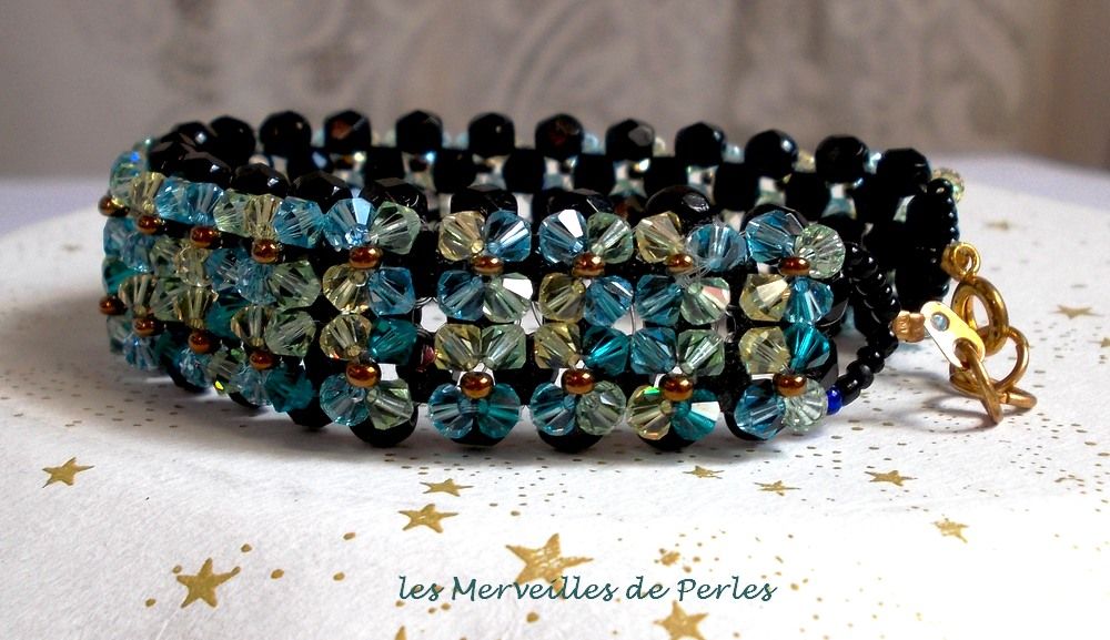 Glittrande Aurora-armband med svarta facetter och färgade snurrande toppar i Swarovski-kristall