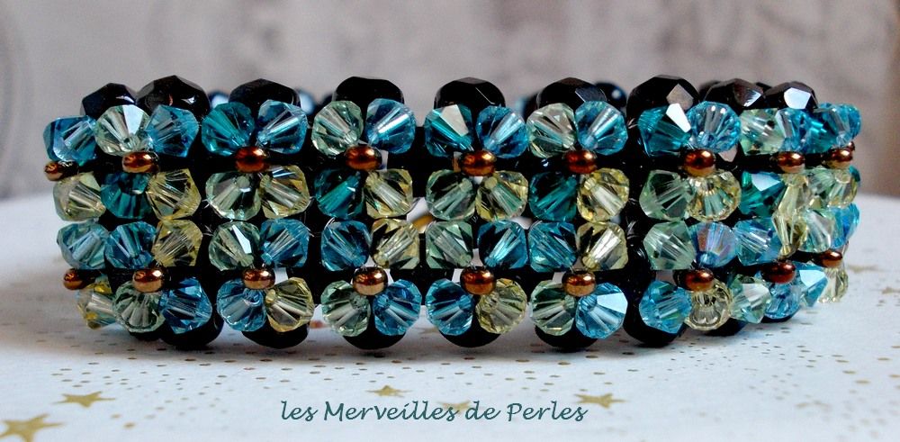Glittrande Aurora-armband med svarta facetter och färgade snurrande toppar i Swarovski-kristall