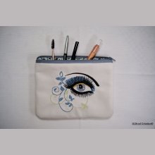 Platt fodral med broderat arabesque-öga